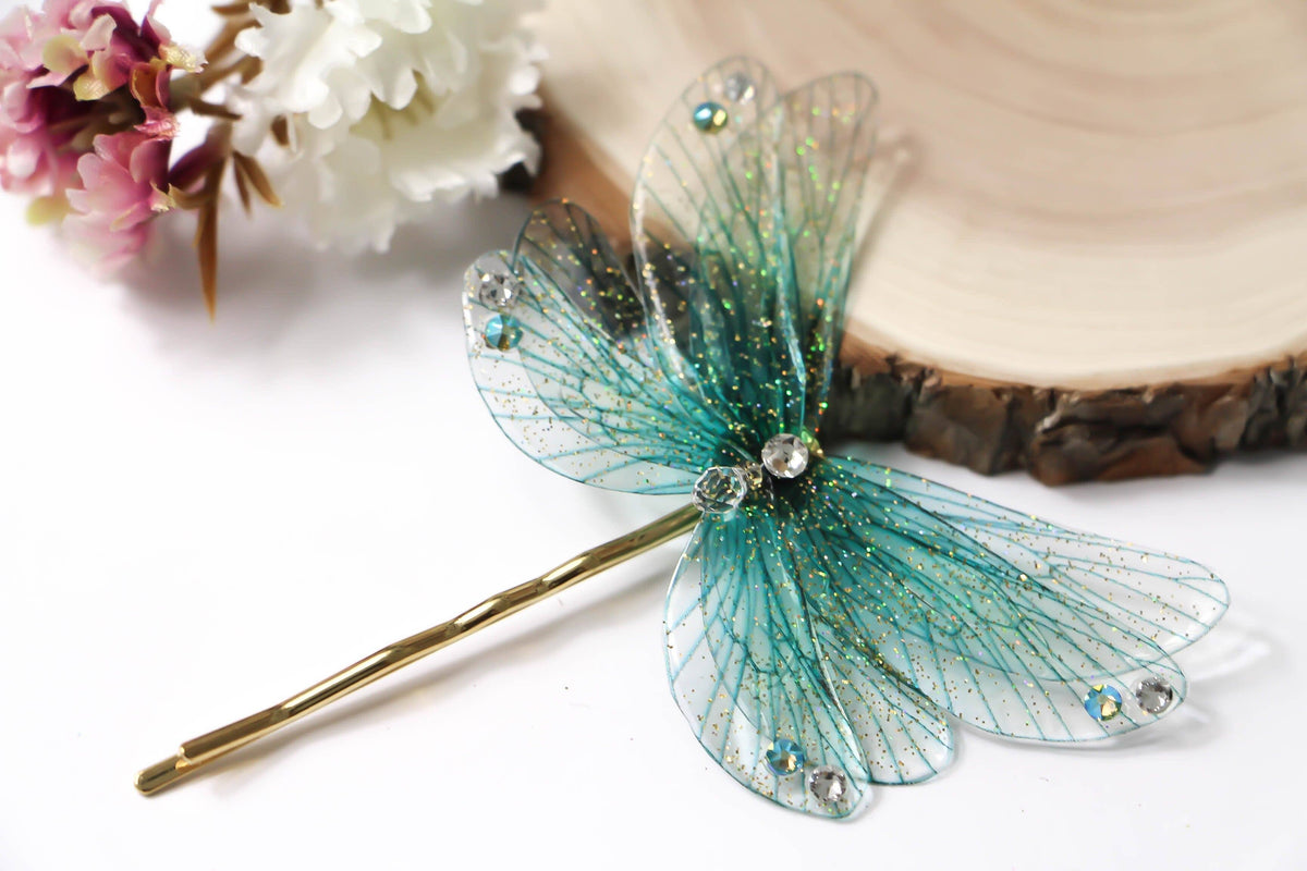 Forcina per capelli The Other World con ali turchesi iridescenti