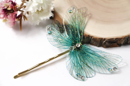 Forcina per capelli The Other World con ali turchesi iridescenti